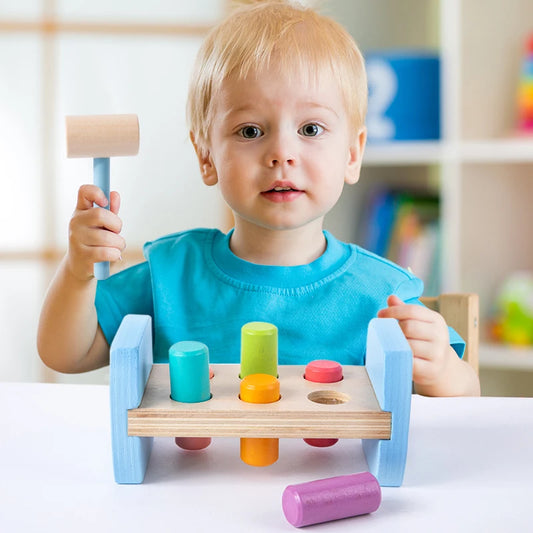 Wooden Colorful Pounding Toy Features assorted colorful pegs and a wooden hammer Kids have a blast hammering away